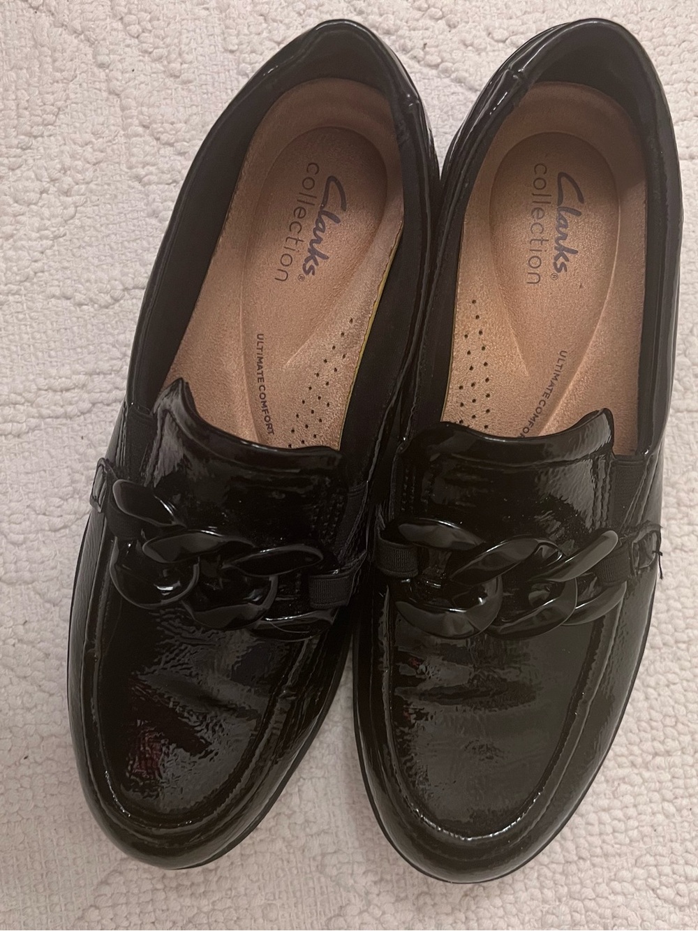 Clarks Women’s Black Patent Slip-On Loafers with Gloss Chain Detail